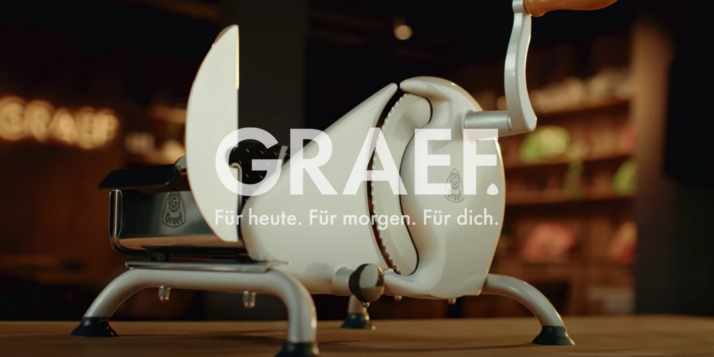 Affettatrice Graef, bianca, con slogan: Per oggi. Per domani. Per te.
