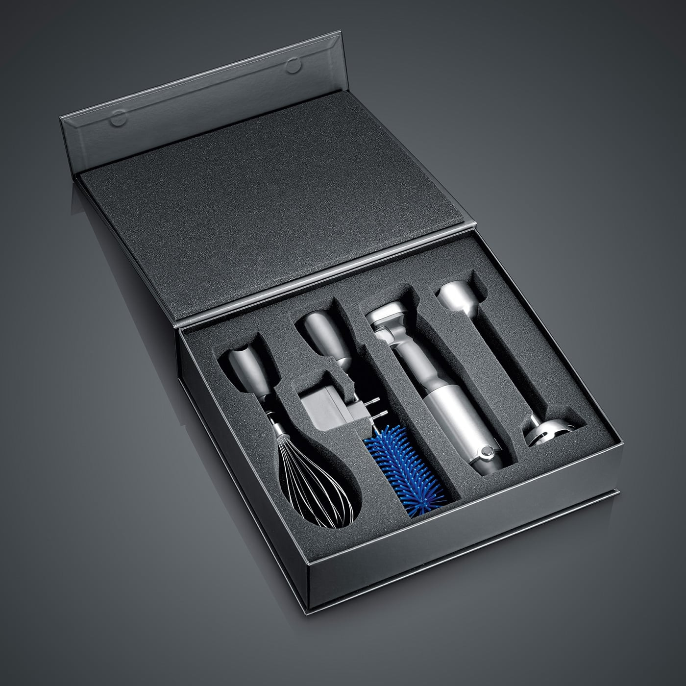 Black box with kitchen tools embedded in foam, a set for cooking.