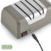 Electric knife sharpener, grey, with charging cable and battery indicator, charging.