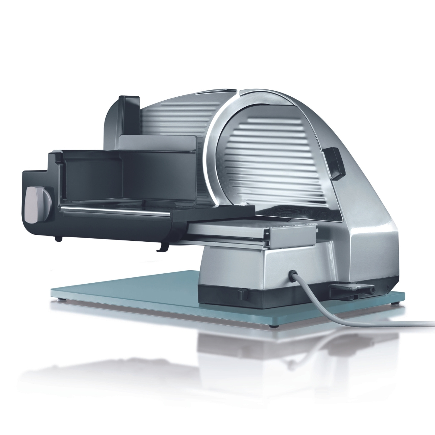 Electric slicer, silver, with blade and base, isolated on white background, kitchen appliance