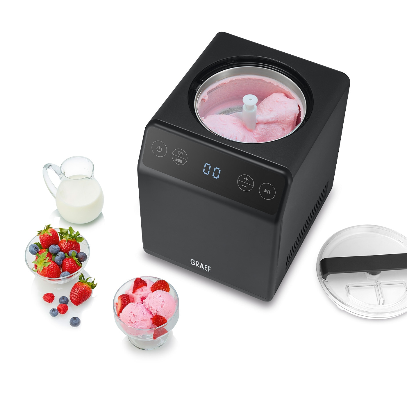 Ice cream maker with ice cream, berries, milk and lid. Black device.