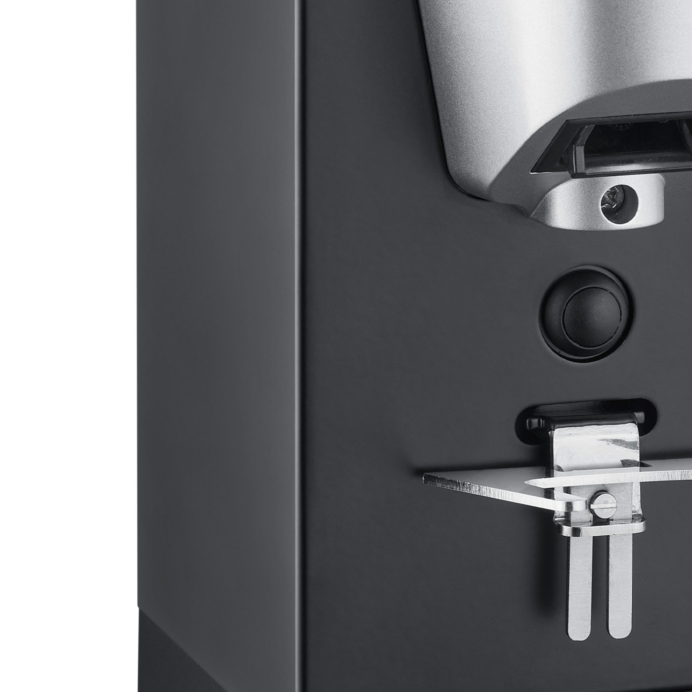 Gros plan d'un appareil noir avec des accents argentés et un bouton