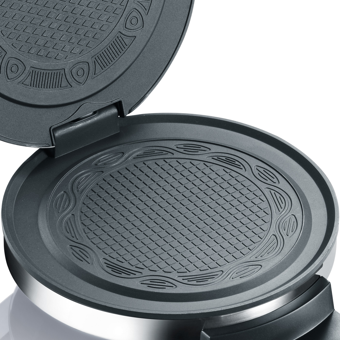 Open waffle maker with detailed baking surfaces and silver rim.