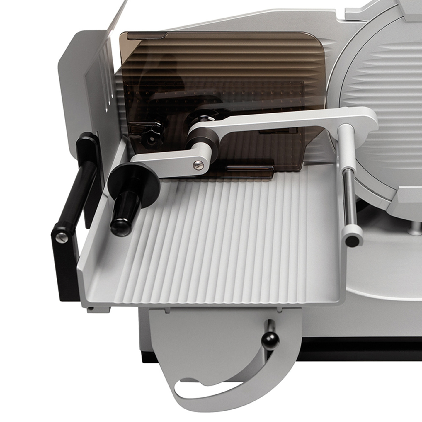 Meat slicer, silver, with guard, handle and blade, close-up, isolated on white