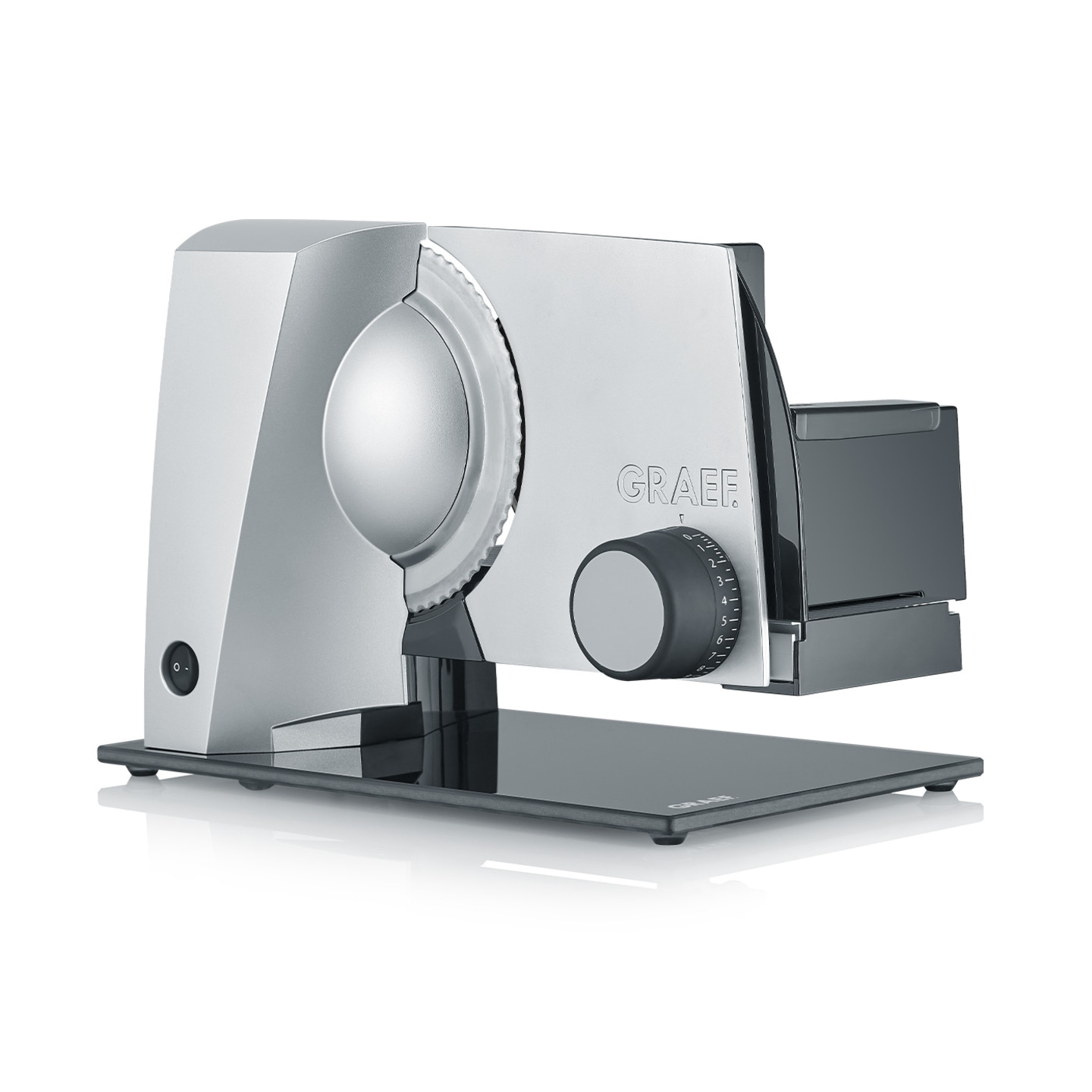 Silver Graef slicer with dial and blade on glass base, kitchen appliance for food