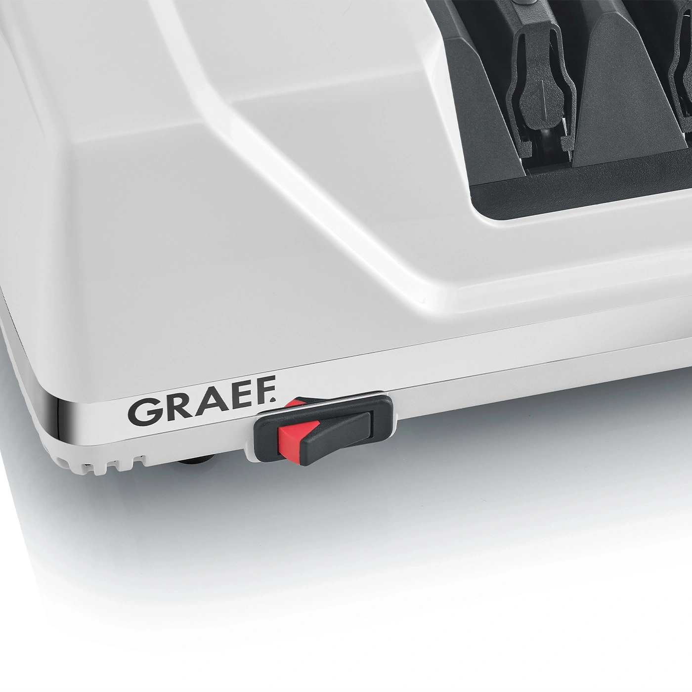 Un appareil blanc avec le logo GRAEF et un interrupteur rouge/noir.