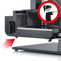 Meat slicer with red arrow and warning symbol for safety instructions