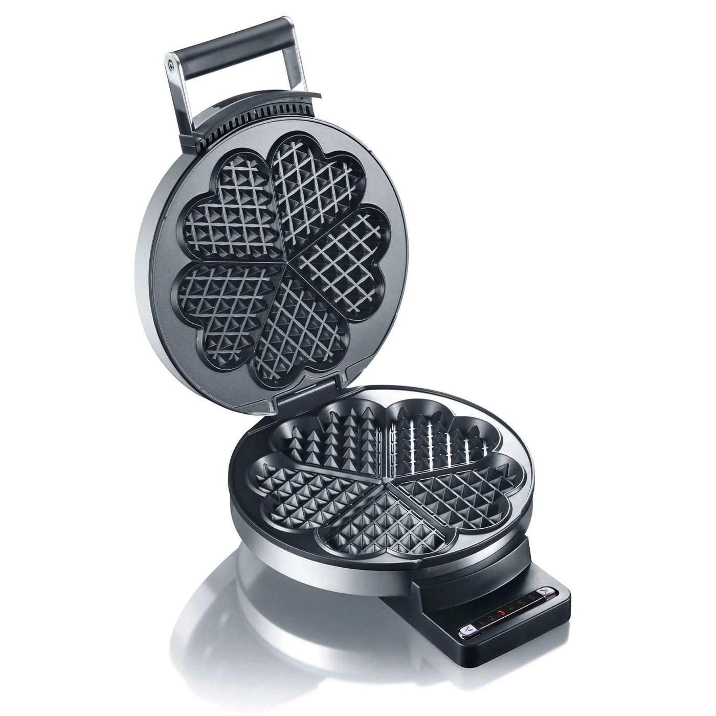 Waffle iron, open, with heart-shaped waffle molds, ready to bake waffles.