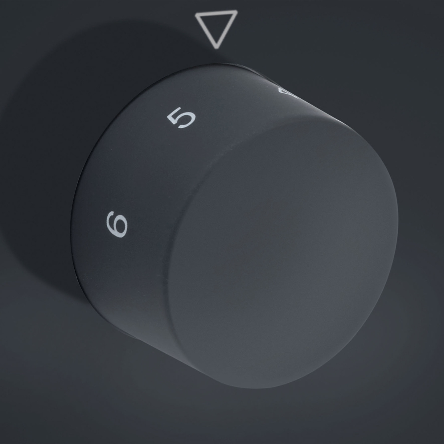 Rotary knob with numbers 5 and 6, dark background, triangle mark, gray
