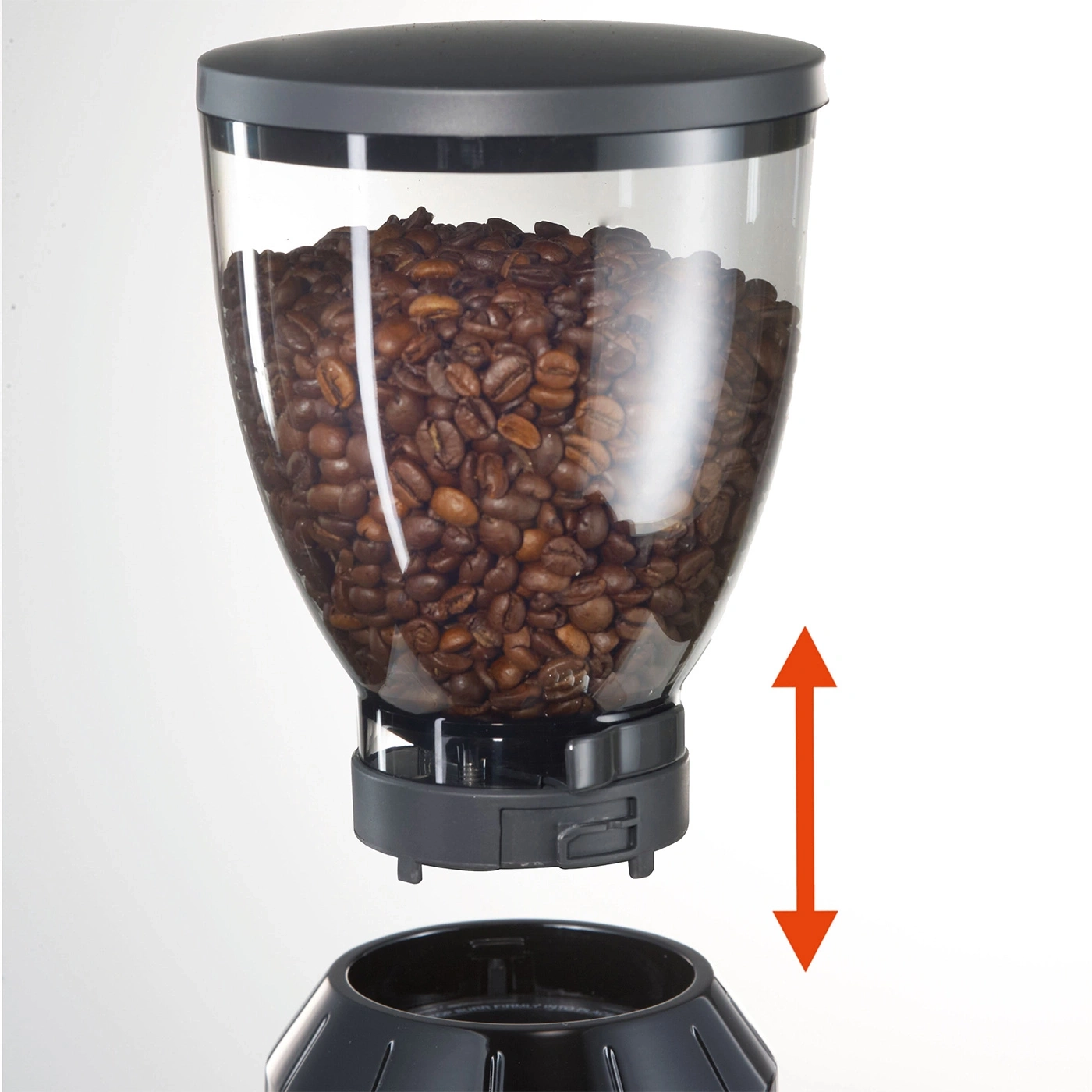 Coffee bean hopper being placed onto a coffee grinder