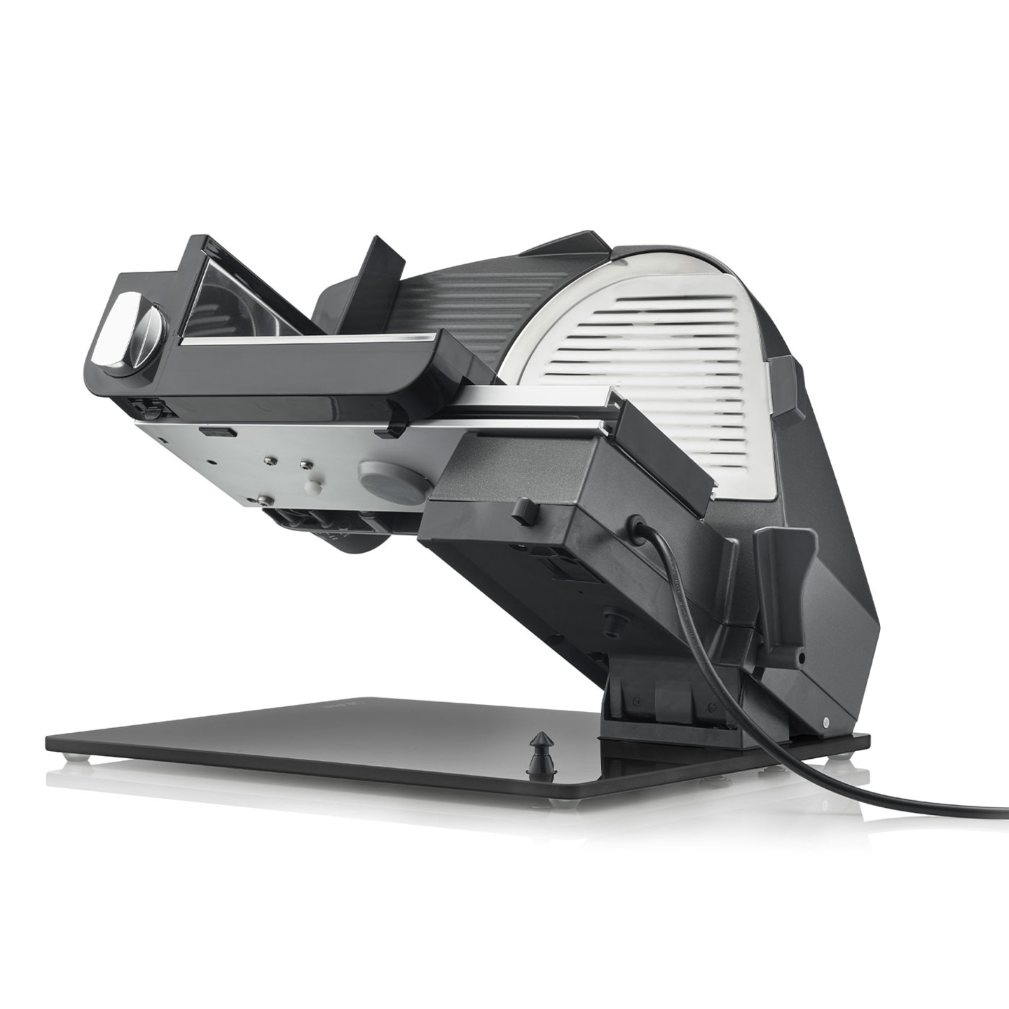 Electric slicer, black, angled, with cable and base, isolated on white background