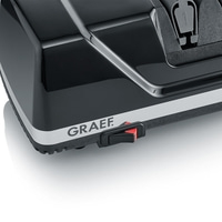 Dispositivo nero con interruttore rosso e logo GRAEF su sfondo bianco, primo piano.