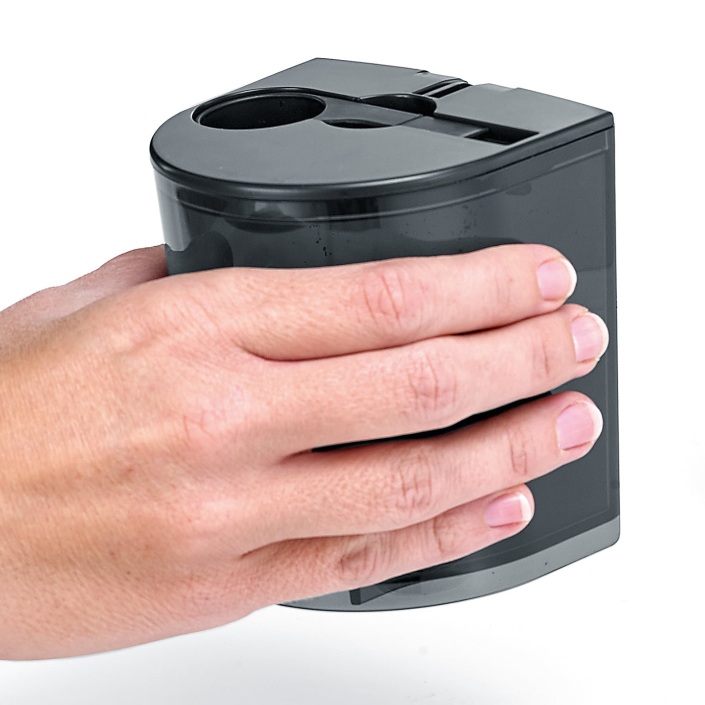 Hand holding a black container with holes against a white background.