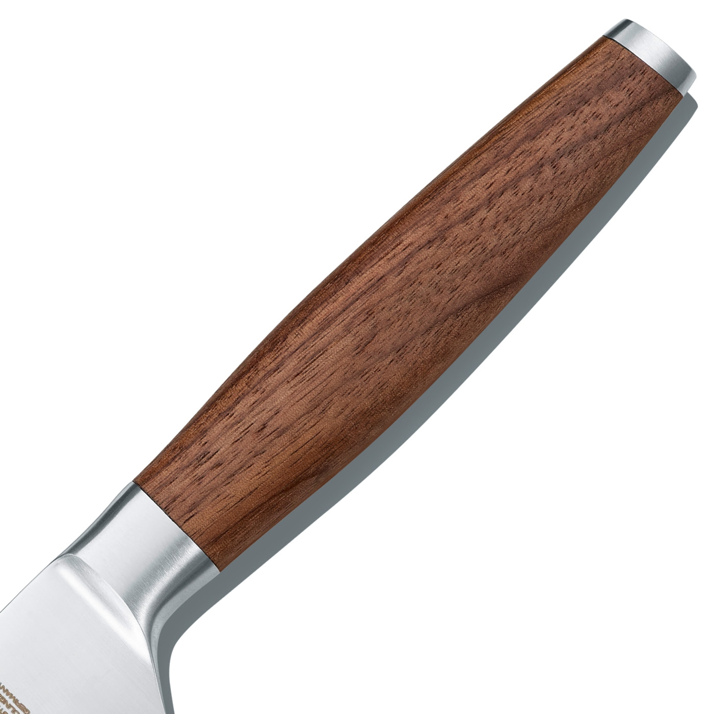 Close-up of a wooden and metal knife handle, isolated on white