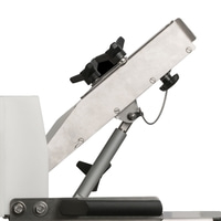 Metal construction with black knobs and white plastic part, angled position