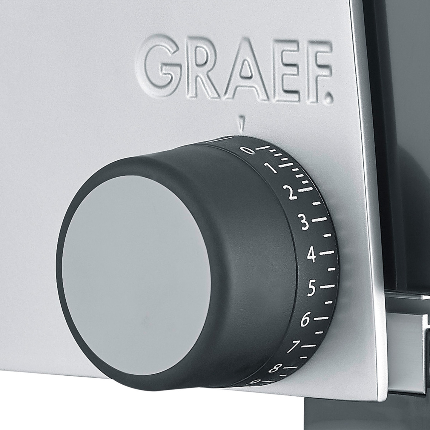 Close-up of a Graef slicer with a black dial and numbers from 0 to 8.