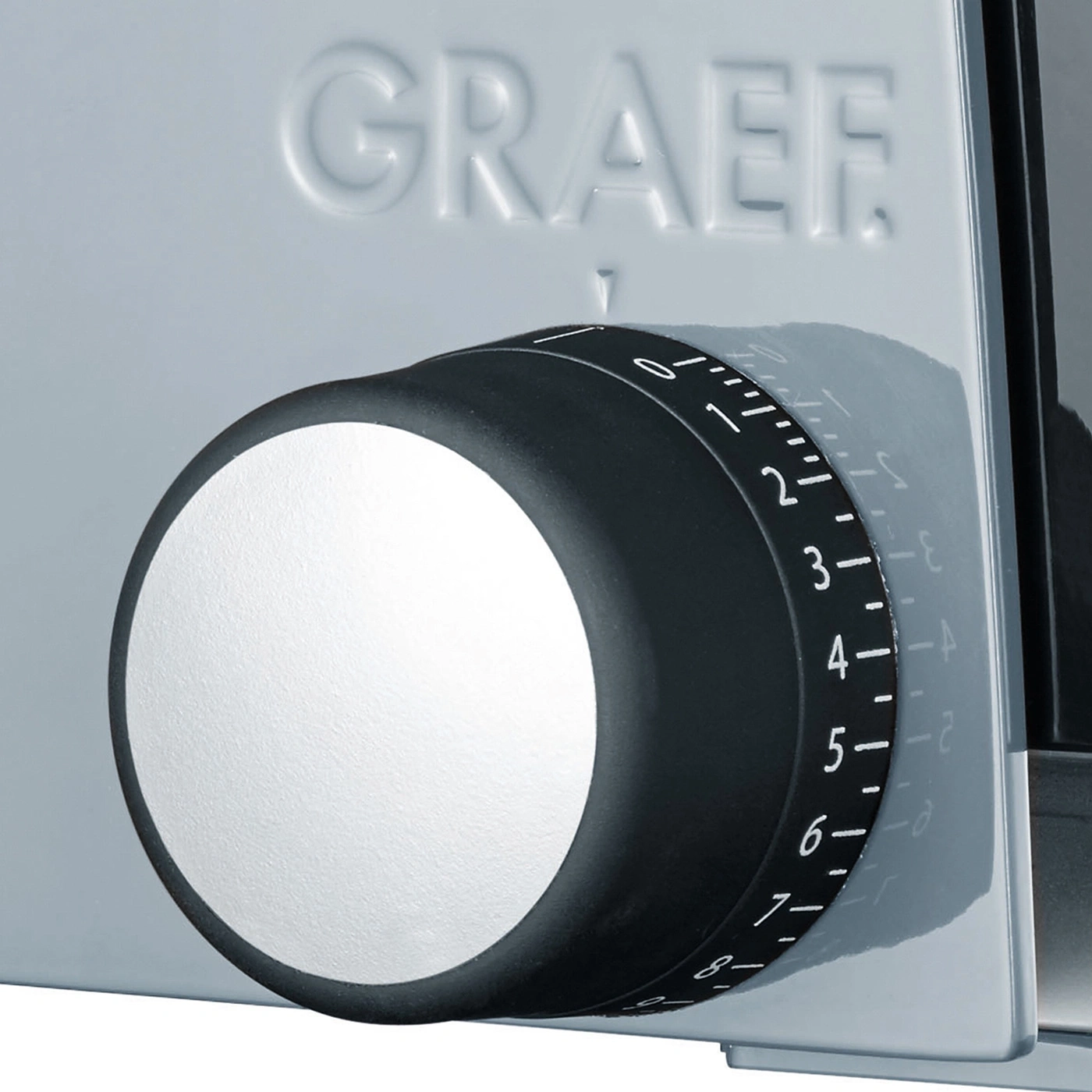 Graef slicer with thickness adjustment dial, black and white, close-up