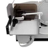 Meat slicer, silver, with guard, handle and blade, close-up, isolated on white