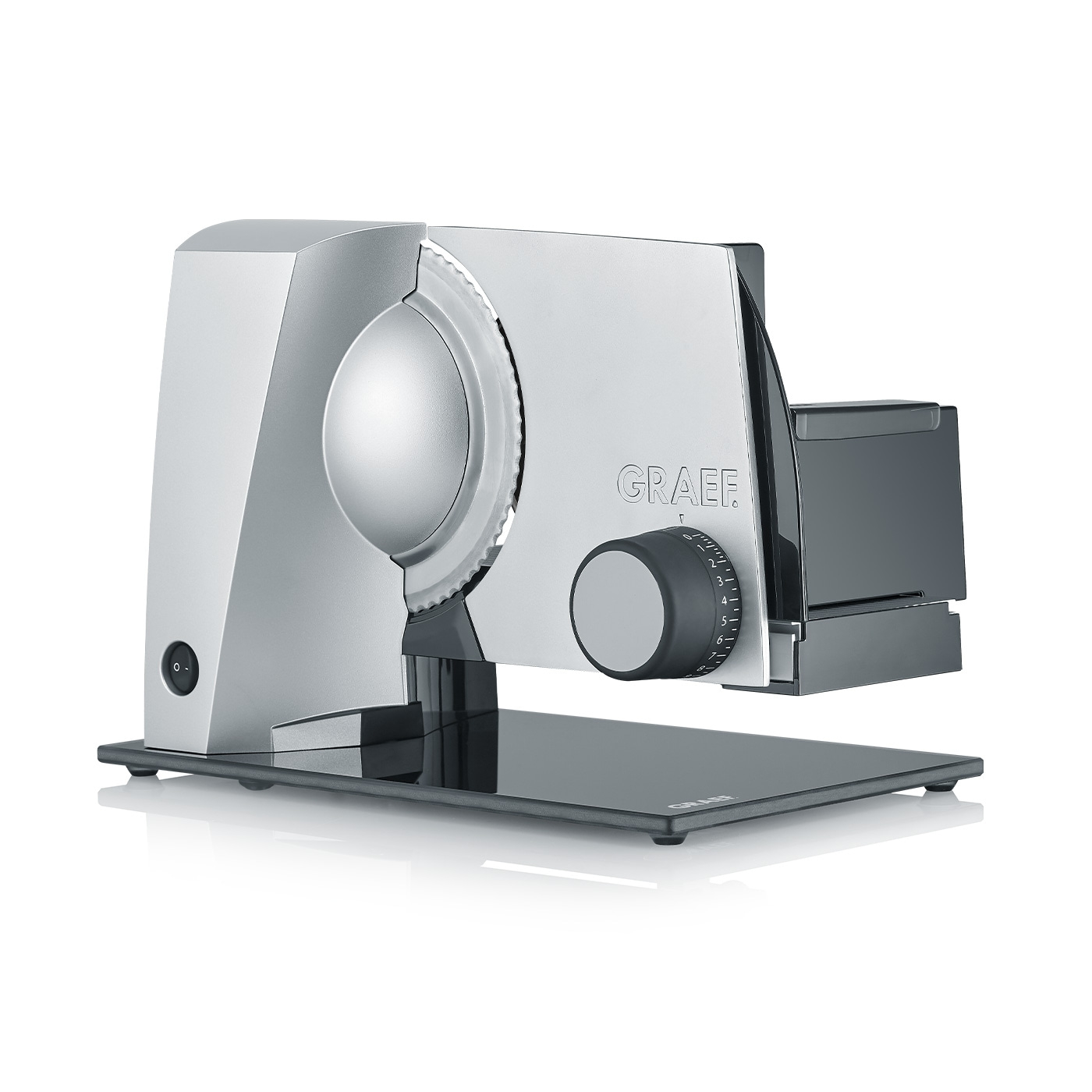 Silver Graef slicer with dial and blade on glass base, kitchen appliance for food