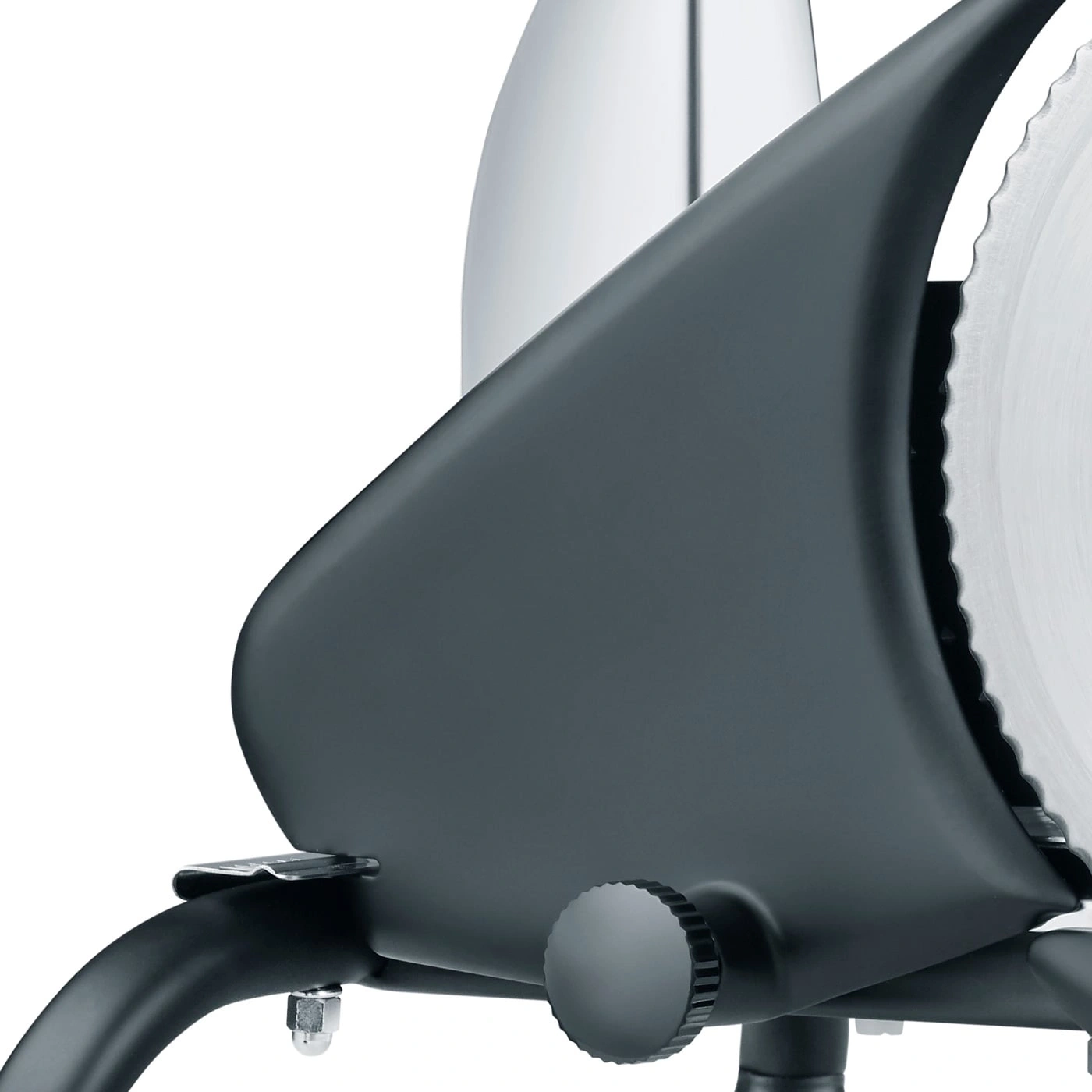 Close-up of a gray slicer with a serrated blade and a knob, isolated.