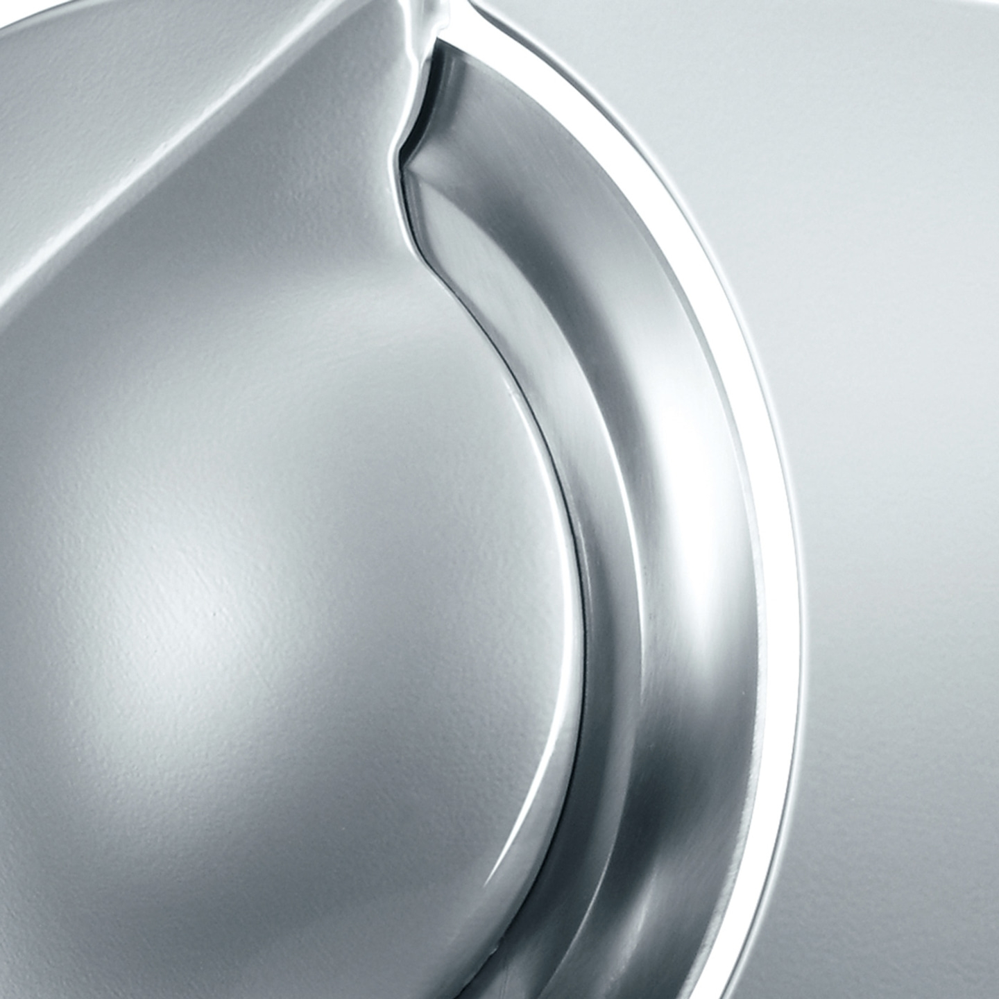 A close-up of a metallic form with curved lines and highlights.
