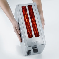 Toaster held by hands, stainless steel, GRAEF, toasting, kitchen, appliance, warm