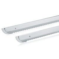 Two silver bread knives with serrated blades on a white background, close-up.