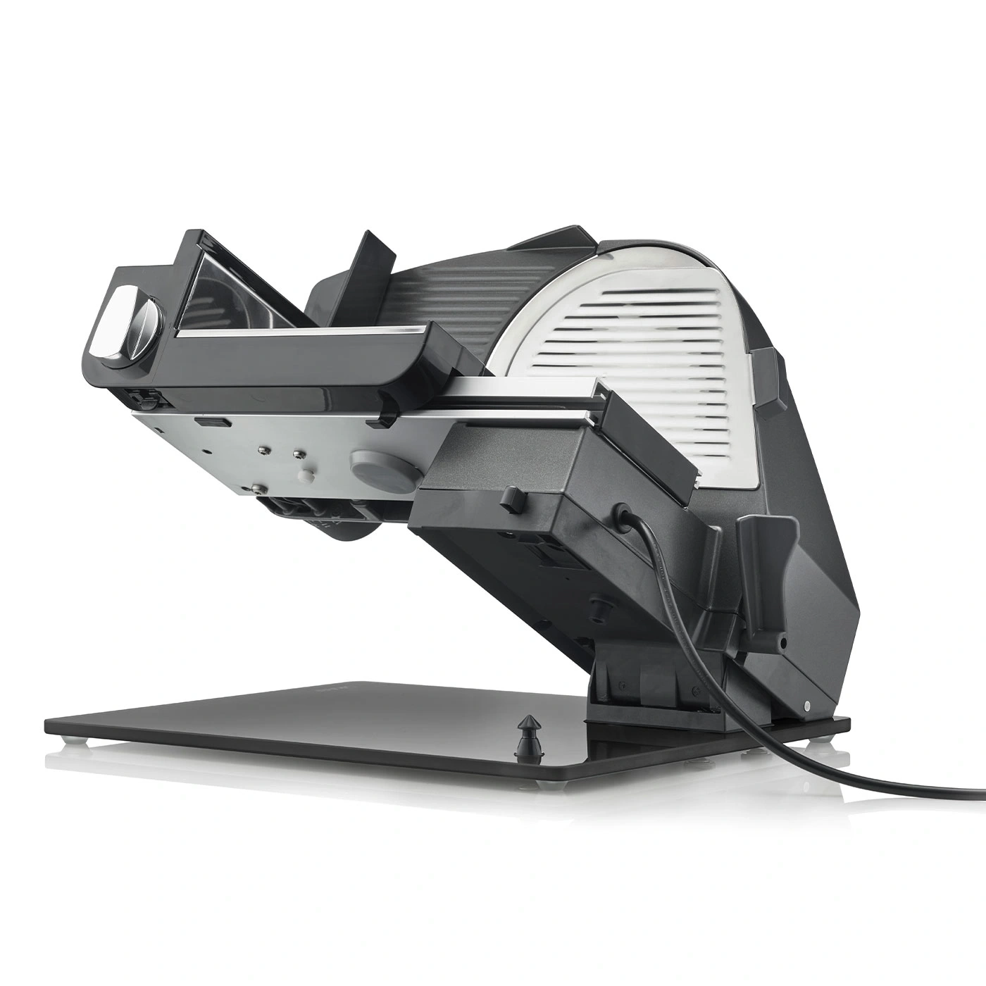 Electric slicer, black, angled, with cable and base, isolated on white background