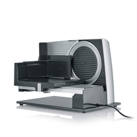 Silver electric Graef food slicer with blade, for slicing various food items.