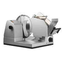 Silver Graef food slicer with blade and control knobs, close-up shot on white background