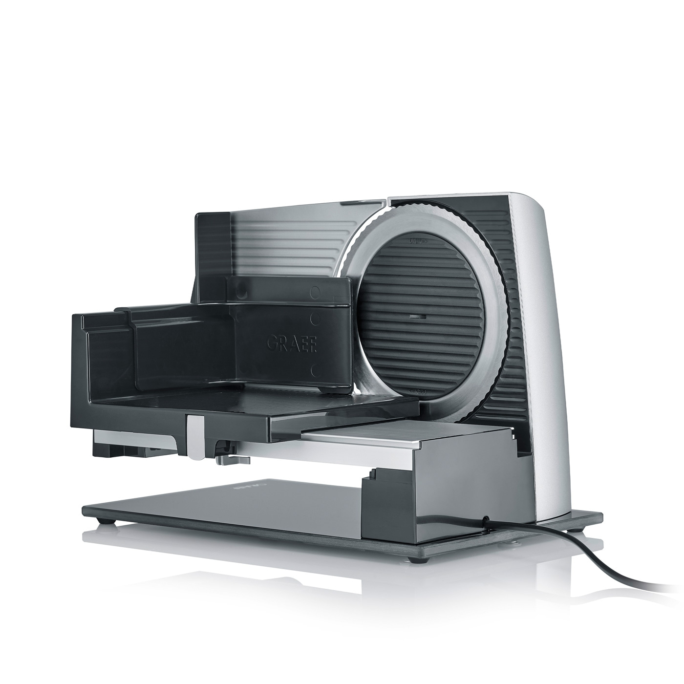 Silver electric Graef food slicer with blade, for slicing various food items.
