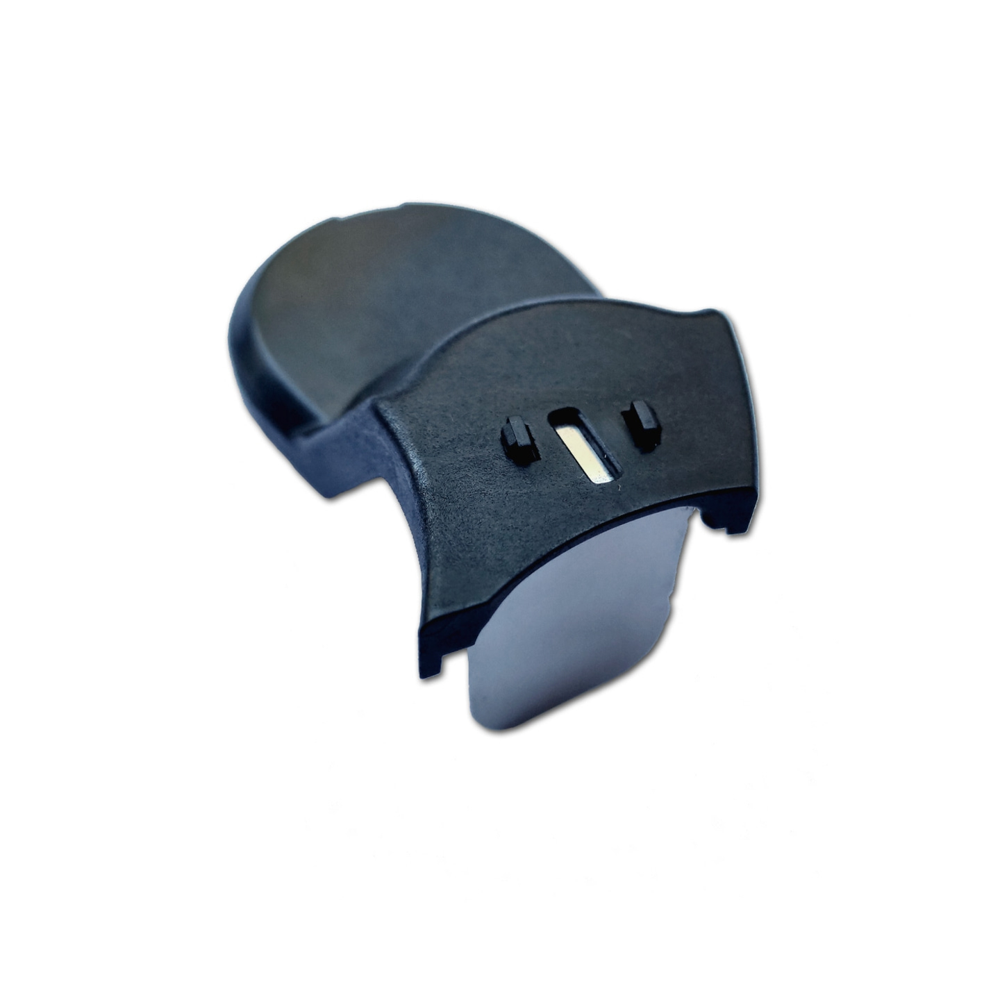 Pièce en plastique noir avec des trous et une forme incurvée sur fond blanc