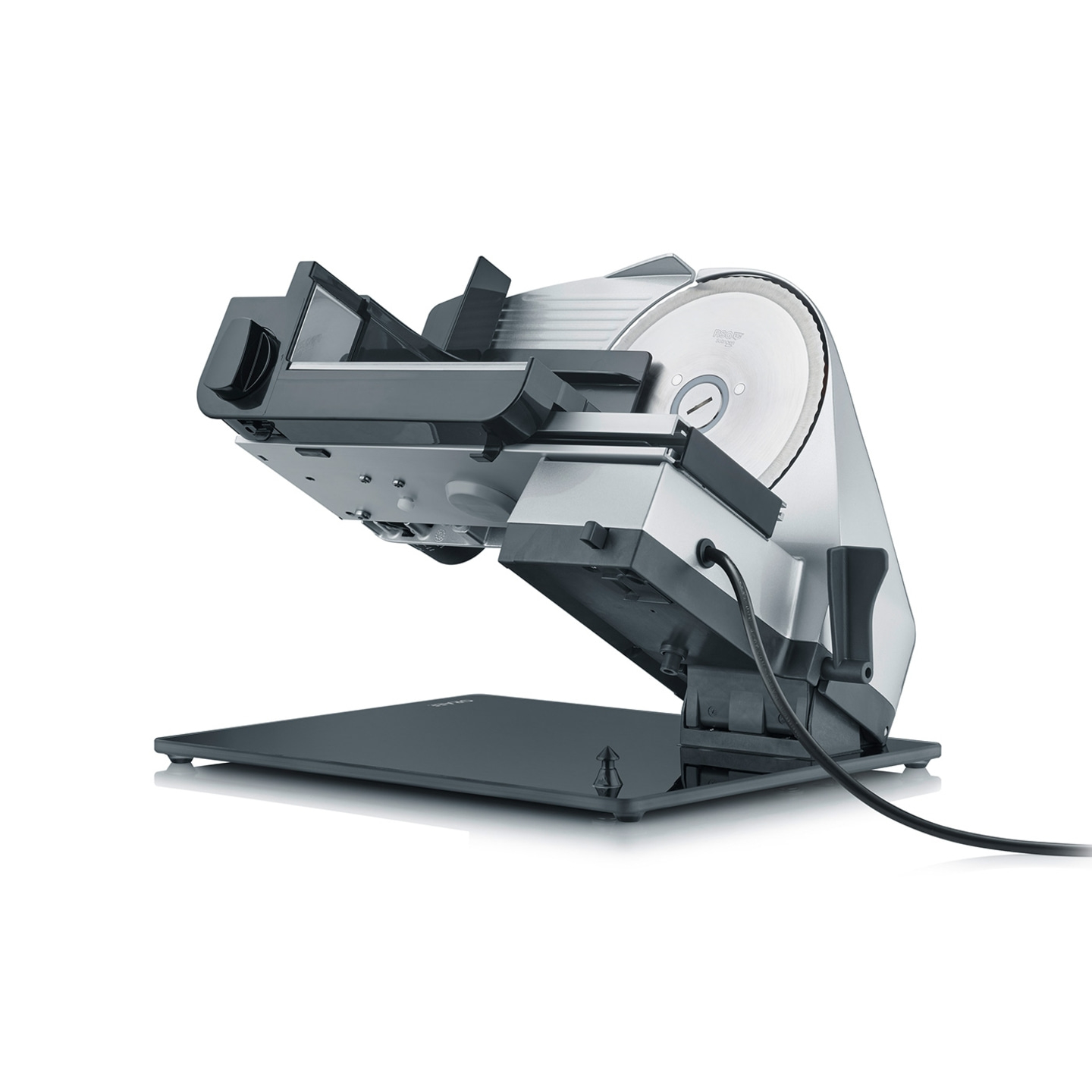 Electric food slicer, gray and silver, isolated on a white background, angled view.