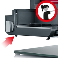 Une flèche rouge pointe vers une petite goupille noire sous l'appareil.