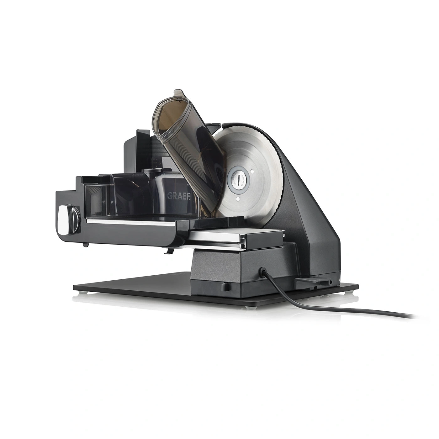 Black electric slicer with a round saw blade and a power cord.