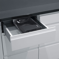 Drawer with coffee grinder, black countertop, kitchen cabinet, Graef logo visible.