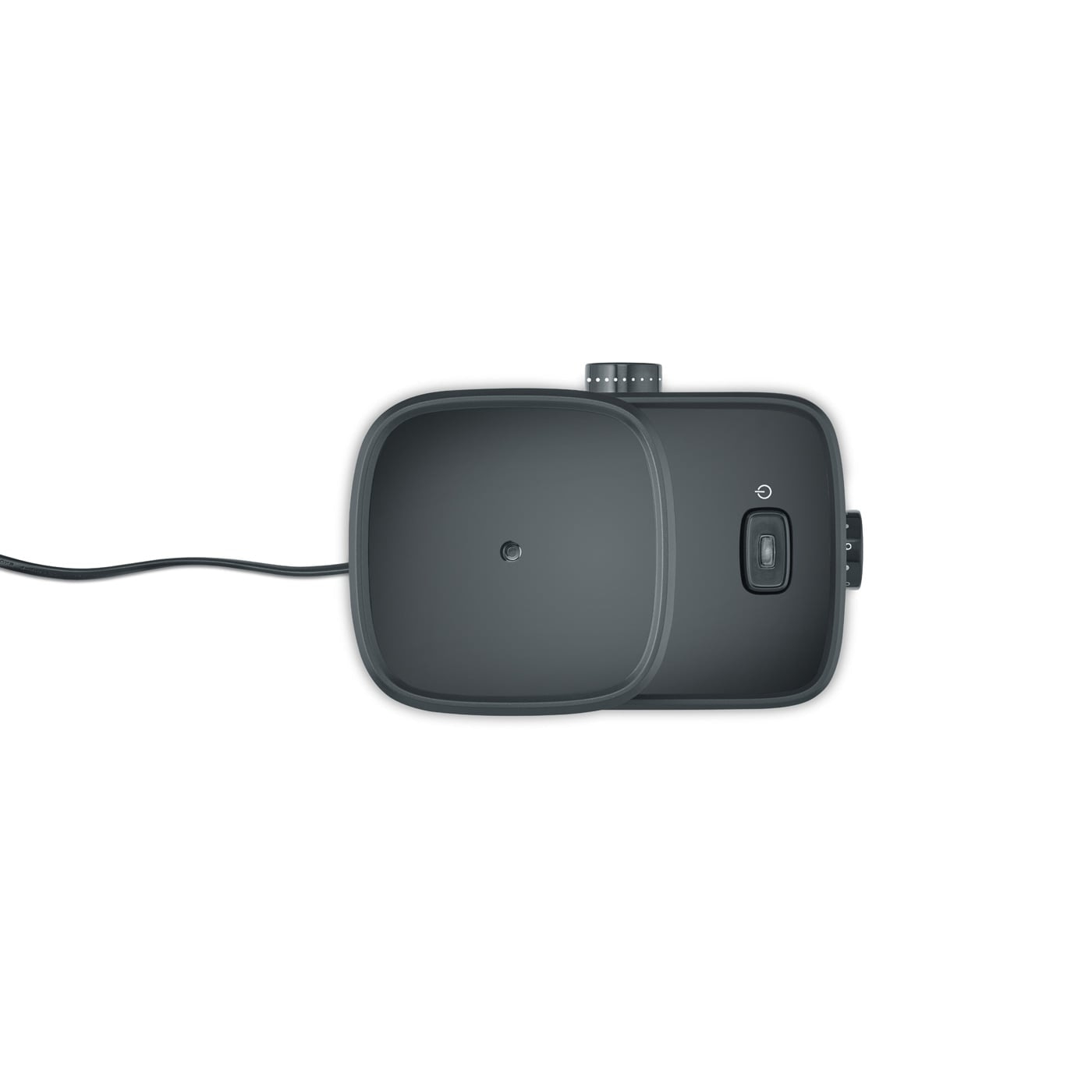 Appareil gris foncé avec boutons et câble sur fond blanc.