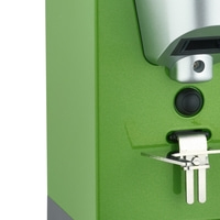 Green machine with button and lever, close-up, detail shot, appliance