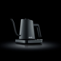 Black electric kettle with GRAEF logo on black background, sleek design.