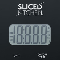 Kitchen scale displaying 18:8.8.8, units, and TARE function with black background.