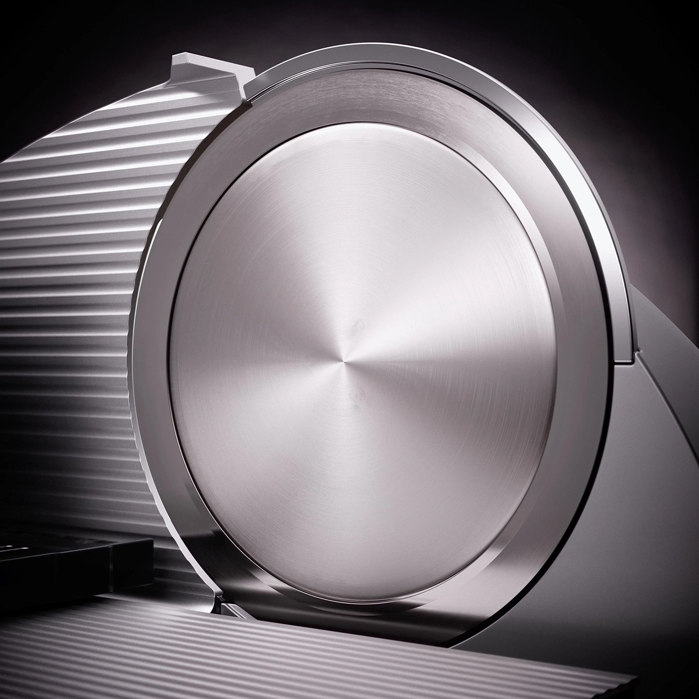 Close-up of a silver slicer with a shiny surface and shadows, modern design