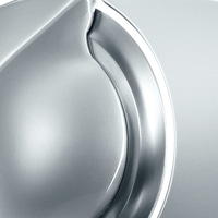 A close-up of a metallic form with curved lines and highlights.