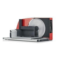 Red electric slicer with large circular blade and black housing, isolated