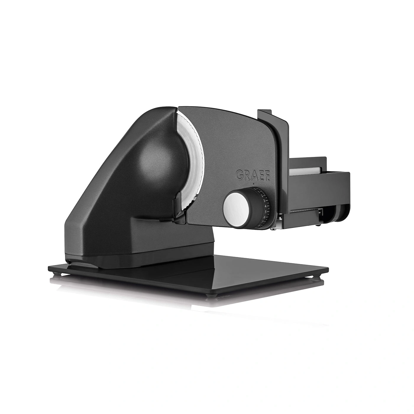 Black electric slicer with silver blade and GRAEF logo, on a black base.