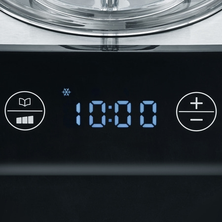 Close-up of control panel showing time 10:00 and various symbols