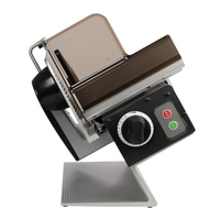 Electric food slicer, black, silver, brown, with buttons and dial, angled view