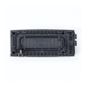 Top view of a black electronic device with holes and buttons.