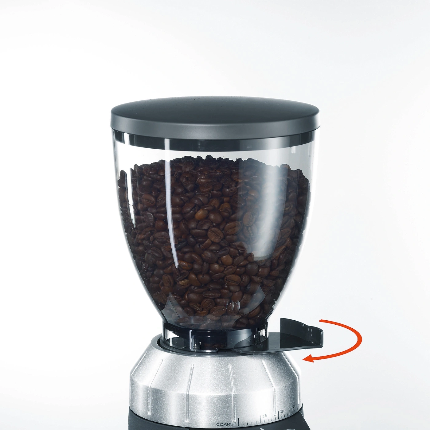 Coffee grinder with beans, black lid, and arrow indicating grind size adjustment