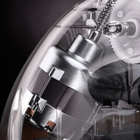 Transparent machine with metal parts and gears, close-up, technology, engineering