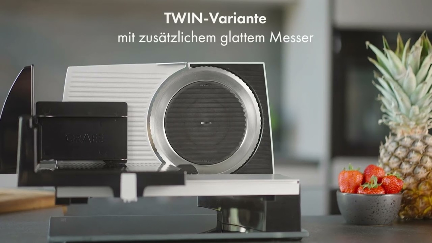 Trancheuse Graef avec ananas et fraises. Variante TWIN avec couteau lisse.